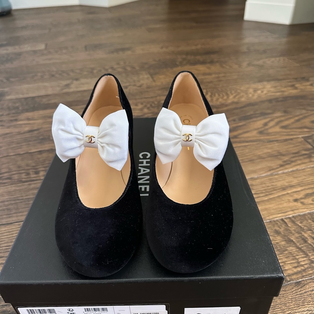CHANEL Black velvet Mary Jane’s with White Bow